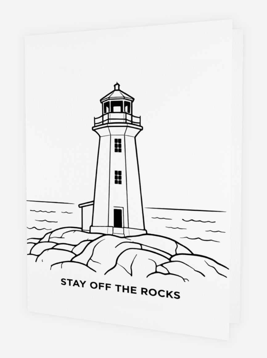 Bold black line art colouring greeting card featuring the Peggy’s Cove lighthouse perched on smooth granite rocks with the Atlantic Ocean in the background. The phrase STAY OFF THE ROCKS appears at the bottom. White card shown at an angle on white background.